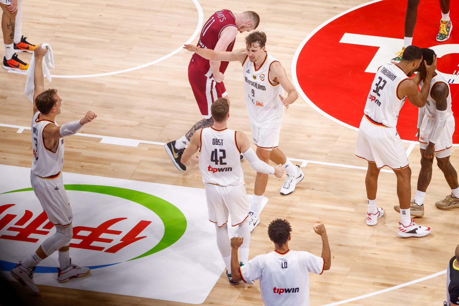 epa10843661 German players celebrate following their win over Latvia during the FIBA Basketball World Cup 2023 quarter final match between Germany and Latvia at the Mall of Asia in Manila, Philippines, 06 September 2023.  EPA/MARK R. CRISTINO