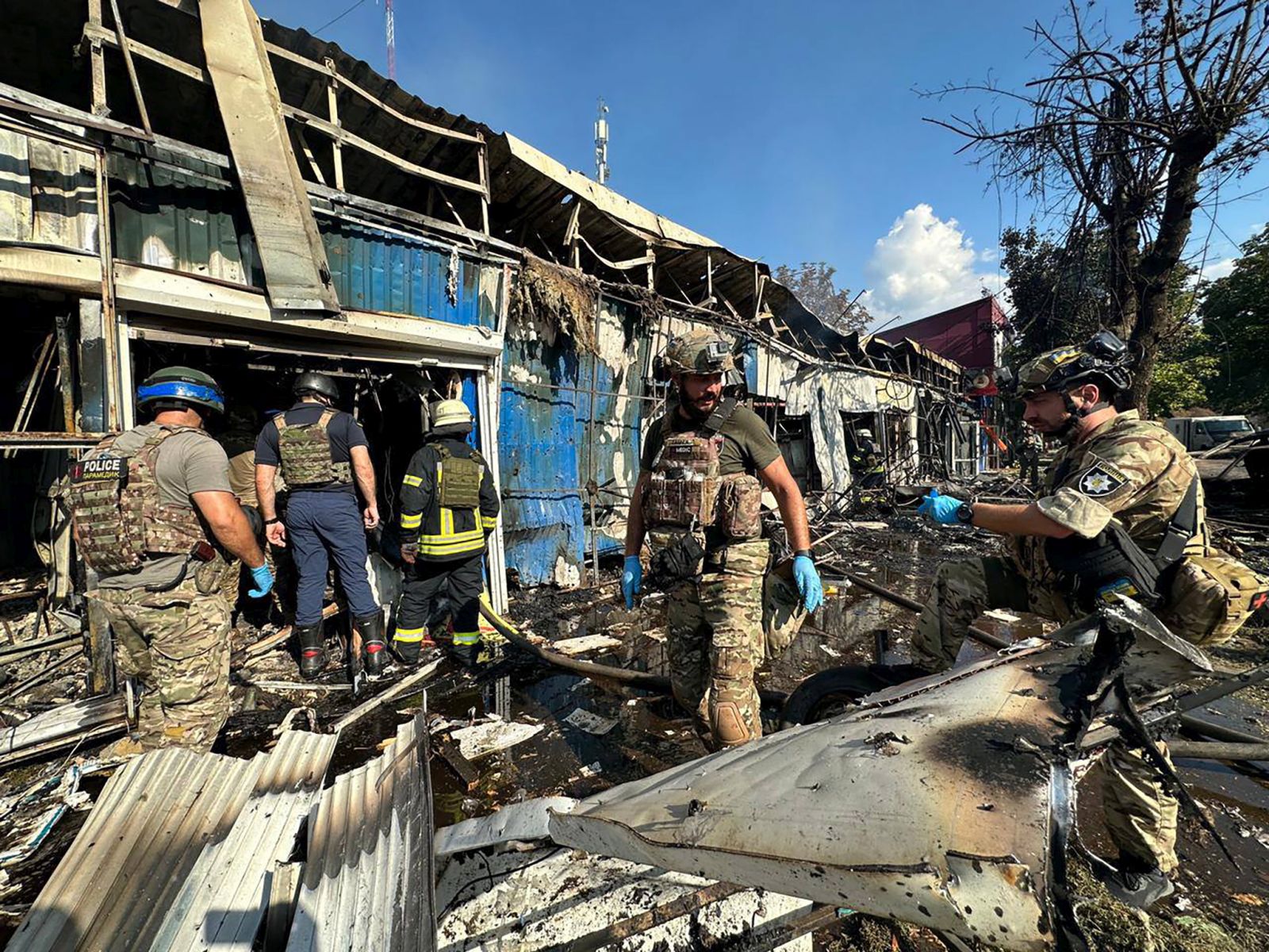 epa10844213 A handout photo made available by the official telegram channel of Ukraine's Minister of Internal Affairs Ihor Klymenko shows police officers and rescuers inspecting the site of a military strike in Kostyantynivka, Donetsk region, eastern Ukraine, 06 September 2023, amid the Russian invasion. At least 16 people died and 28 others were injured after Russian shelling targeted a market in Kostyantynivka, in eastern Ukraine's Donetsk region, Ukraine's Minister of Internal Affairs Ihor Klymenko wrote on telegram, adding that a rescuer was among the victims. A search and rescue operation is ongoing at the site.  EPA/INTERIOR MINISTER OF UKRAINE IHOR KLYMENKO HANDOUT -- BEST QUALITY AVAILABLE -- MANDATORY CREDIT: UKRAINE'S MINISTER OF INTERNAL AFFAIRS IHOR KLYMENKO -- HANDOUT EDITORIAL USE ONLY/NO SALES