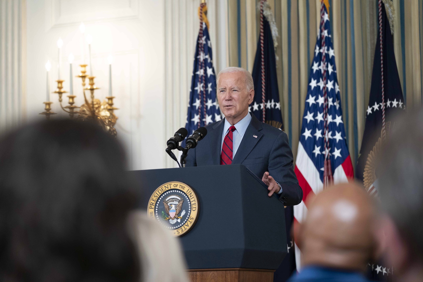 epa10845076 US President Joe Biden speaks to leaders of the International Longshore and Warehouse Union (ILWU) and the Pacific Maritime Association (PMA) on finalizing a new labor contract covering West Coast ports in the State Dining Room at the White House in Washington, DC, USA, 06 September 2023.  EPA/BONNIE CASH / POOL