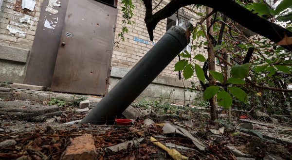 epa10846750 Part of a missile next to a destroyed apartment block in the frontline town of Orikhiv, Zaporizhzhia Oblast, Ukraine, 07 September 2023, amid the Russian invasion. The town, located less than 10 kilometers from the nearest Russian army position, witnesses daily attacks from Russian forces. Its school was operating as a center for distribution of humanitarian aid until the premises were hit by two consecutive air strikes. Airstrike survivor Lubov Jarova says that her dog saved her life. Following the first strike, she ran after it outside the school when the second strike happened, destroying the building and killing seven people. Today Lubov lives in Zaporizhzhia, around 65 kilometers north-west, and she occasionally brings humanitarian aid to her hometown. Before the war, Orikhiv had a population of over 14,000. The town is currently home to around 700 people.  EPA/KATERYNA KLOCHKO  ATTENTION: This Image is part of a PHOTO SET