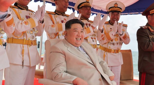 epa10847729 A photo released by the official North Korean Central News Agency (KCNA) shows North Korean leader Kim Jong Un (C) presiding over a launching ceremony for what is said to be a tactical nuclear-armed submarine, designated No. 841 or Hero Kim Kun Ok, at the Sinpho shipyard in North Korea, 06 September 2023 (issued 08 September 2023).  EPA/KCNA   EDITORIAL USE ONLY