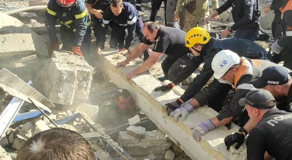 epa10848021 A handout photo made available by Ukraine's Minister of Internal Affairs, Ihor Klymenko, via telegram shows rescuers and police officers working to release a police officer from debris at a site of a missile strike in Kryvyi Rih, Dnipropetrovsk region, central Ukraine, 08 September 2023, amid the Russian invasion. A policeman was killed and 54 others, among them nine police officers, were injured as a result of a Russian missile strike targeting one of the police administration buildings in Kryvyi Rih on 08 September, Ukraine's Minister of Internal Affairs, Ihor Klymenko wrote on telegram.  EPA/UKRAINE'S MINISTRY OF INTERNAL AFFAIRS HANDOUT -- BEST QUALITY AVAILABLE -- MANDATORY CREDIT: IHOR KLYMENKO, UKRAINE'S MINISTER OF INTERNAL AFFAIRS -- HANDOUT EDITORIAL USE ONLY/NO SALES