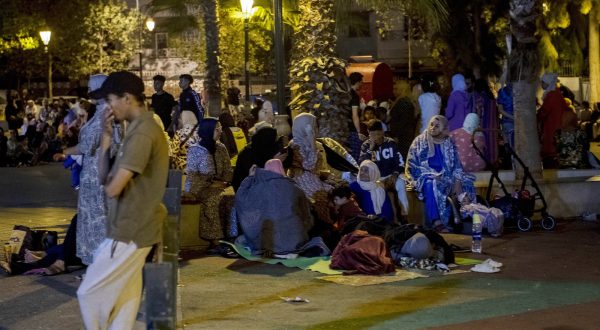 epa10849885 People seek safety outside after an earthquake in Rabat, Morocco, 08 September 2023. A 6.8-magnitude earthquake struck Morocco late 08 September, damaging buildings in major cities and sending panicked people pouring into streets and alleys. According to Morocco's state-run media, at least 296 people died in the earthquake in the provinces and prefectures of Al Haouz, Marrakech, Ouarzazate, Azilal, Chichaoua and Taroudant, and 153 people were injured.  EPA/Jalal Morchidi