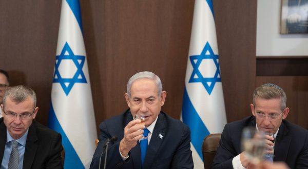 epa10852249 Israeli Prime Minister Benjamin Netanyahu (C) raises a glass to celebrate the upcoming Jewish New Year holiday, at the weekly Cabinet meeting in Jerusalem, 10 September 2023.  EPA/OHAD ZWIGENBERG / POOL