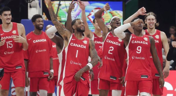 epa10852286 Canada players celebrate after winning the FIBA Basketball World Cup 2023 third place match between Canada and the USA at the Mall of Asia in Manila, Philippines, 10 September 2023.  EPA/FRANCIS R. MALASIG