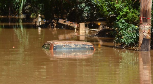 epa10854580 A car submerged in water near Larissa, after storm Daniel swept across central Greece, 11 September 2023. Several neighbourhoods within the city of Larissa remain flooded, with the level of the water undiminished, while the damage is extensive and there are public health fears due to pollution, including of the water table. The death toll from floods in Greece has risen to 15.  EPA/APOSTOLIS DOMALIS