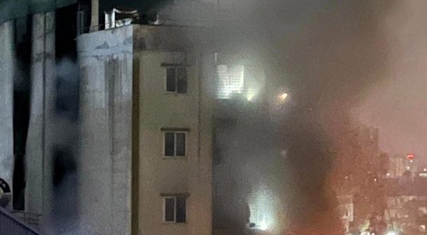 epa10857844 A handout photo made available by Vietnam News Agency (VNA) shows a fire and smoke coming out of an apartment block in Hanoi, Vietnam, 13 September 2023. The fire started on the first floor of the nine-storey apartment at midnight, and was contained by 2am, according to VNA. Many people were believed dead and several injured, according to the official news agency.  EPA/VIETNAM NEWS AGENCY  HANDOUT EDITORIAL USE ONLY/NO SALES
