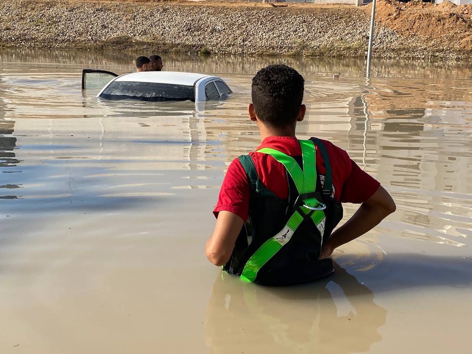 epa10858018 A handout photo made available by the Libyan Red Crescent shows members of the organization inspecting vehicles in the floods at an undefined location in eastern Libya, 11 August 2023 (issued 13 September 2023). The Red Cresent said that the floods caused by storm Daniel on 10 September in eastern Libya left thousands of people dead and missing.
Â  Â   EPA/HANDOUT  HANDOUT EDITORIAL USE ONLY/NO SALES