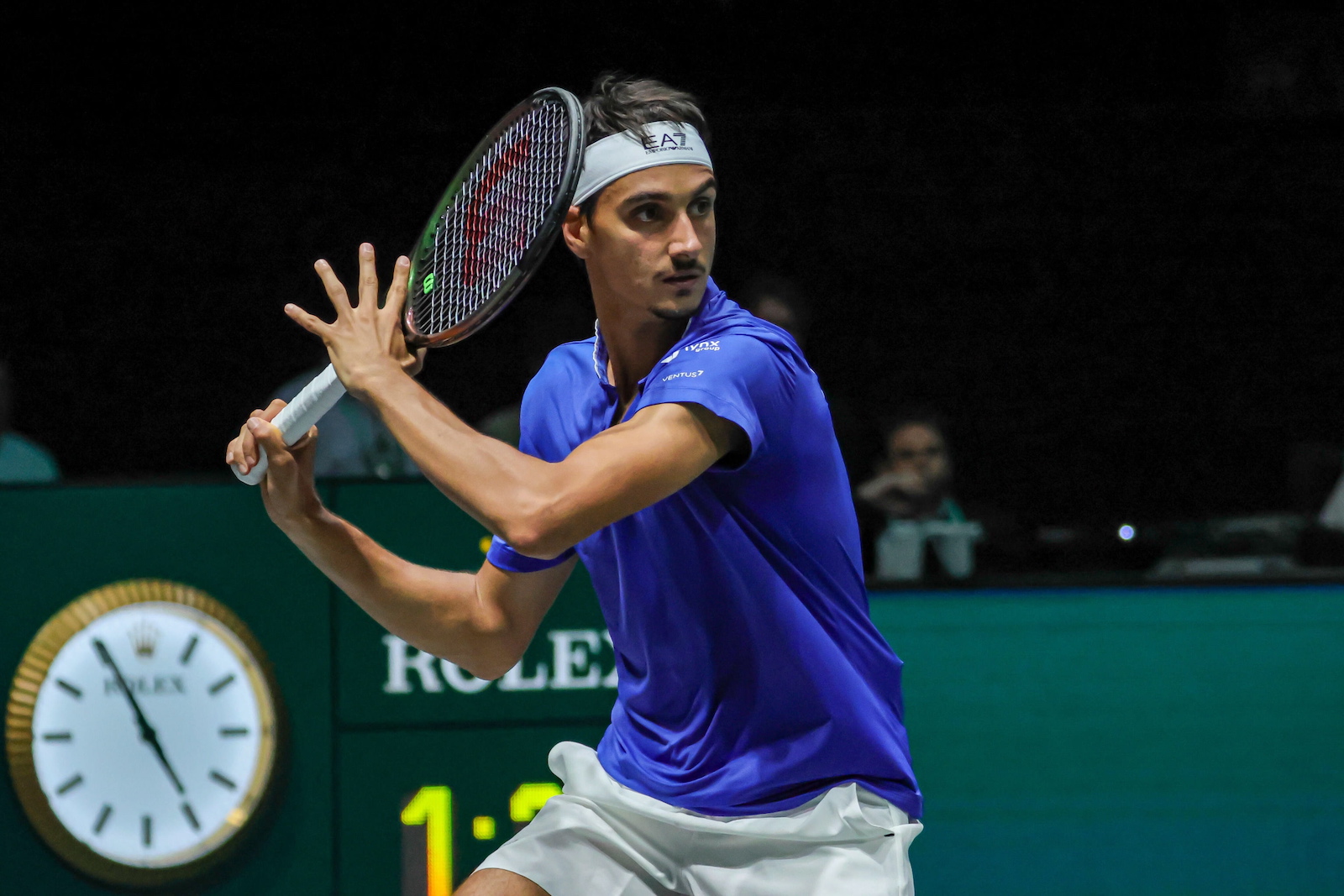 epa10858832 Lorenzo Sonego of Italy in action against Alexis Galarneau of Canada (not pictured) during the Davis Cup 2023 Group A match between Italy and Canada, in Bologna, Italy, 13 September 2023.  EPA/FABIO PATAMIA
