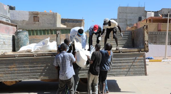 epa10859581 Rescue workers transport body bags with the remains of victims of the floods, which washed up ashore from the sea, outside the hospital of Derna, Eastern Libya, 13 September 2023, after Storm Daniel brought heavy rains to the area resulting in the collapse of two dams and a flash flood which especially devastated the town of Derna. The Libyan Red Cresent reported that the floods caused by storm Daniel on 10 September in eastern Libya left thousands of people dead and according to preliminary statistics, the number of missing people has exceeded ten thousand people.  EPA/Mohamed Shalash