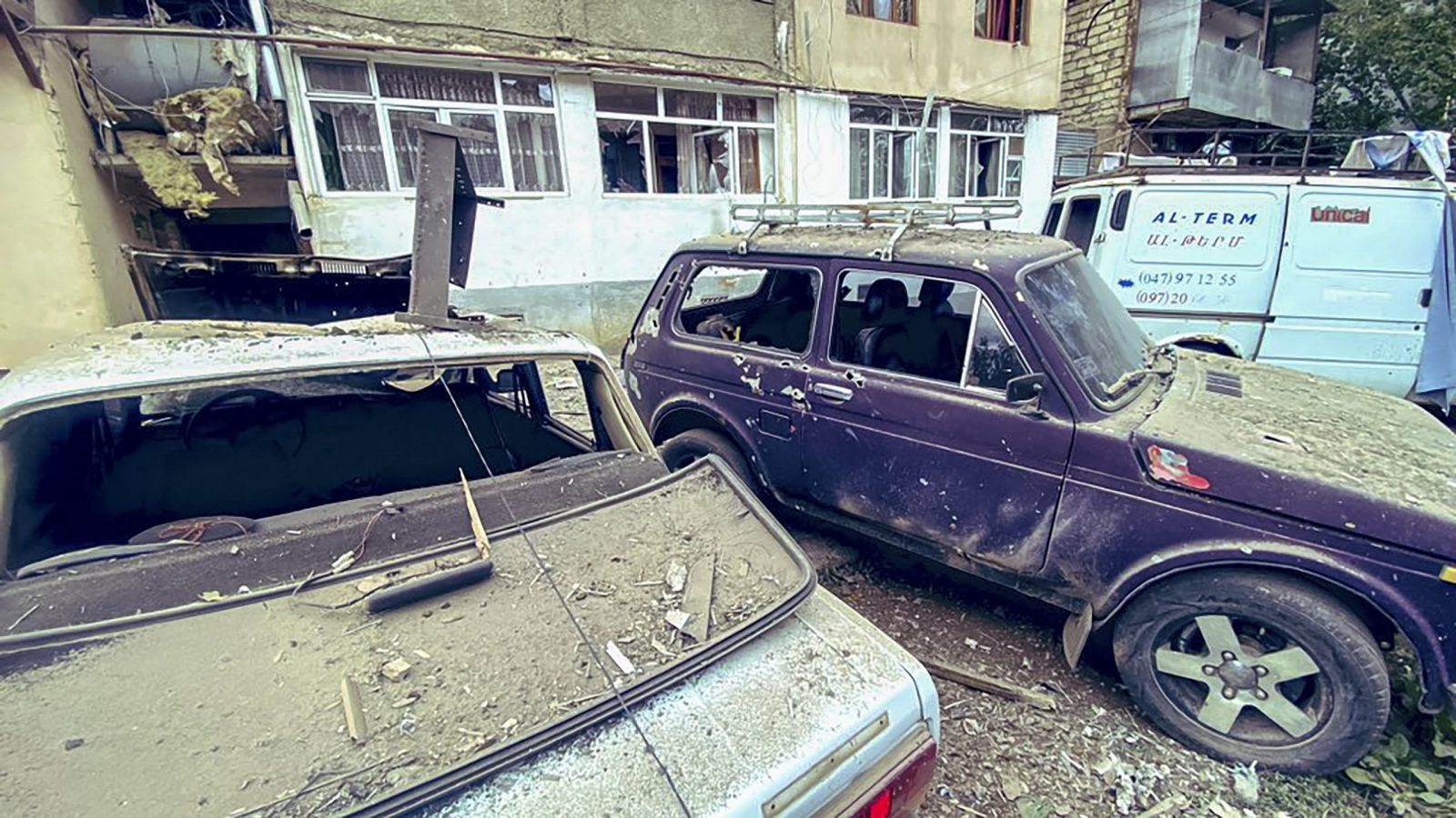 epa10869790 A handout photo made available by OC Media shows damage to residential buildings and vehicles in Stepnakert, Nagorno-Karabakh, 19 September 2023. Azerbaijan's Ministry of Defense announced on 19 September the launching of local 'anti-terrorism' measures against the Armenian military in the disputed Nagorno-Karabakh region in order to restore the constitutional order of Azerbaijan.  EPA/SARGSYAN/OC MEDIA HANDOUT HANDOUT EDITORIAL USE ONLY/NO SALES HANDOUT EDITORIAL USE ONLY/NO SALES