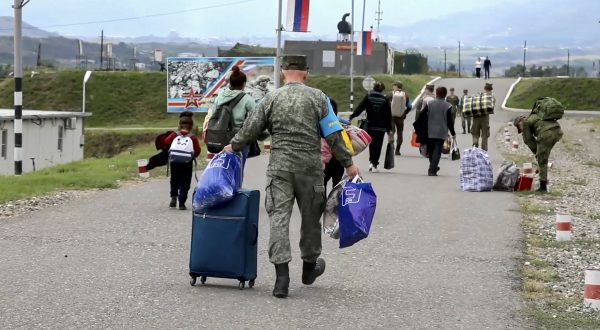 epa10874835 A still image taken from a handout video provided by the Russian Defence Ministry press-service shows civilians at the Russian peacekeepers' camp near Stepanakert, Nagorno-Karabakh, 21 September 2023. About 5,000 people have been brought to the location of the Russian peacekeeping contingent as Russian peacekeepers have evacuated civilians from Martakert, Martuni, and Askeran districts of Nagorno-Karabakh, the Russian Defence Ministry announced on 21 September. Azerbaijan government's announced that a ceasefire was agreed with Armenian separatists in Nagorno-Karabakh on 20 September, after a 24-hour military offensive to take control of the enclave.  EPA/RUSSIAN DEFENCE MINISTRY PRESS SERVICE HANDOUT MANDATORY CREDIT -- BEST QUALITY AVAILABLE HANDOUT EDITORIAL USE ONLY/NO SALES