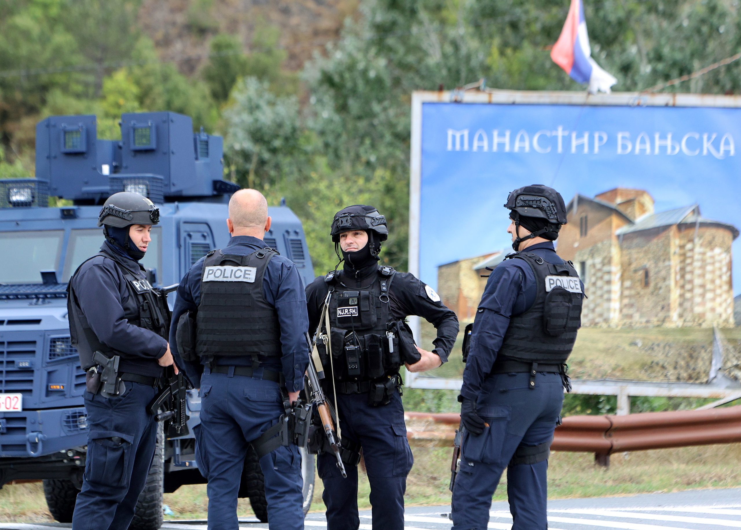epa10882215 Armed Kosovo police officers control the road near the village of Banjska, Kosovo, 25 September 2023. Kosovo is observing a day of mourning after a Kosovo Albanian police officer was killed by Serb gunmen who later barricaded themself in the XIV century Serbian Orthodox Banjska monastery and traded gunfire for hours. Police regained control of the area late on 24 September 2023. The incident comes at a fragile moment in the Kosovo - Serbia European Union-facilitated dialogue to normalize ties between the two parties.  EPA/DJORDJE SAVIC