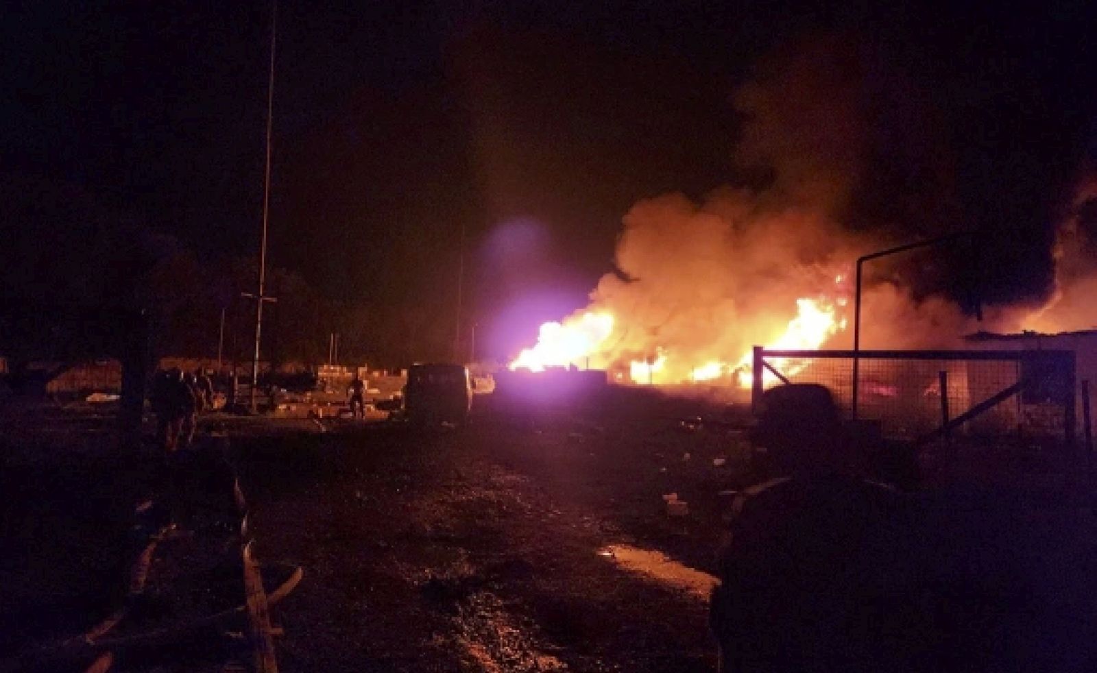 epa10884401 A handout photo made available by Artsakh / Nagorno-Karabakh Human Rights Ombudsman shows firefighters on the site of the fire after an explosion of the petrol warehouse near the Stepanakert-Askera highway in Stepanakert, Nagorno-Karabakh, 25 September 2023 (issued 26 September 2023). According to the Ombudsman of the unrecognized Nagorno-Karabakh Republic (NKR) Gegham Stepanyan, more than 200 people were injured in the explosion. He noted that the region's medical capabilities are not enough to provide assistance.  EPA/ARTSAKH / NAGORNO-KARABAKH HUMAN RIGHTS OMBUDSMAN HANDOUT  HANDOUT EDITORIAL USE ONLY/NO SALES