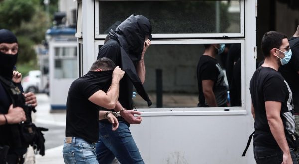 13.08.2023., Atena, Grcka - Poslejdnja skupina privedenih navijaca izlazi pred skudskog istrazitelja izjasniti se o optzbama koje im se stavljau na teret. Inace, svi do sada navijacima koji su izvedeni pred istrazitelja produzen je pritvor. Photo: KOSTAS TZOUMAS/EUROKINISSI/PIXSELL