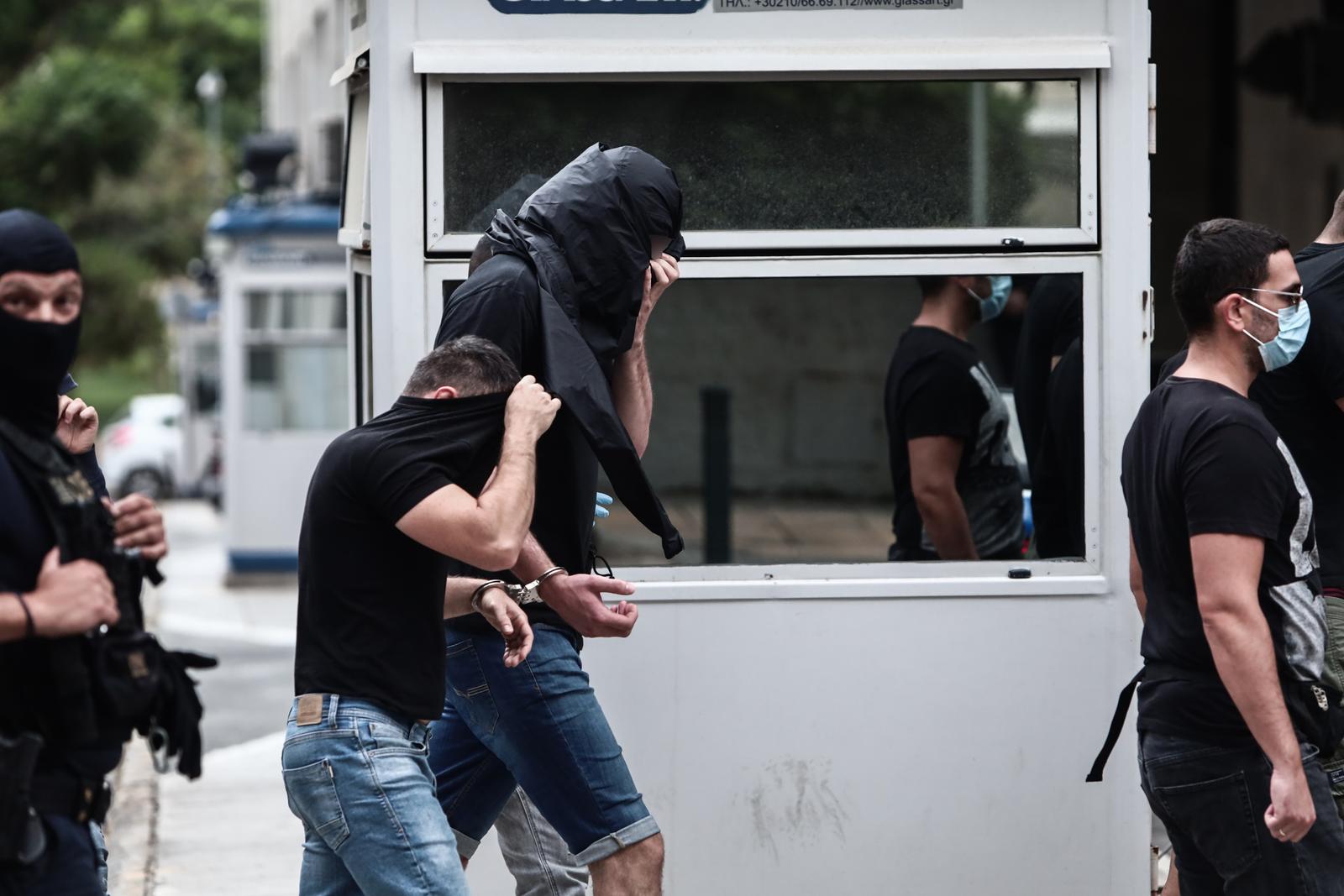 13.08.2023., Atena, Grcka - Poslejdnja skupina privedenih navijaca izlazi pred skudskog istrazitelja izjasniti se o optzbama koje im se stavljau na teret. Inace, svi do sada navijacima koji su izvedeni pred istrazitelja produzen je pritvor. Photo: KOSTAS TZOUMAS/EUROKINISSI/PIXSELL