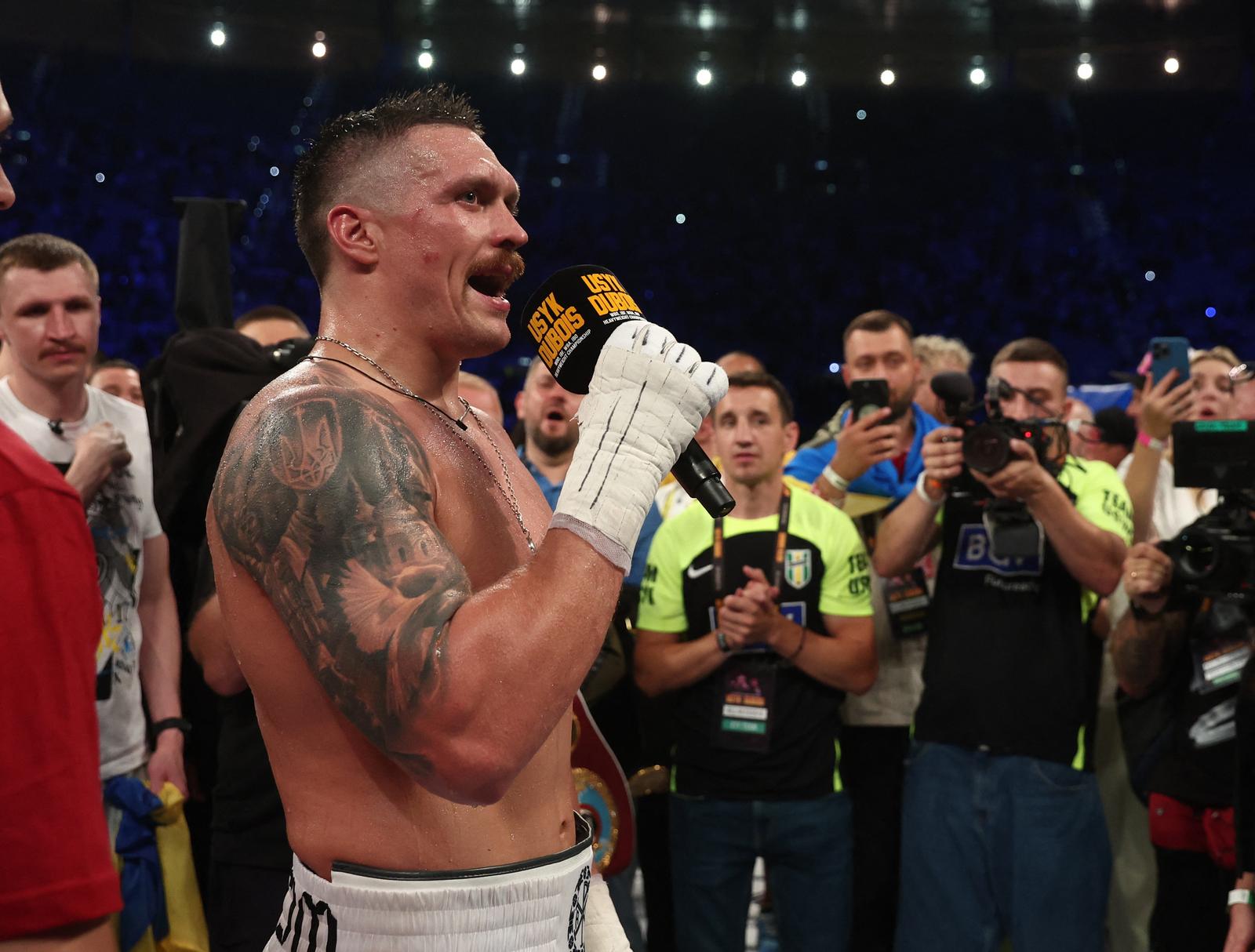 Boxing - WBA, IBF & WBO Heavyweight Titles - Oleksandr Usyk v Daniel Dubois - Tarczynski Arena, Wroclaw, Poland - August 26, 2023  Oleksandr Usyk celebrates after winning his fight against Daniel Dubois REUTERS/Kacper Pempel Photo: KACPER PEMPEL/REUTERS
