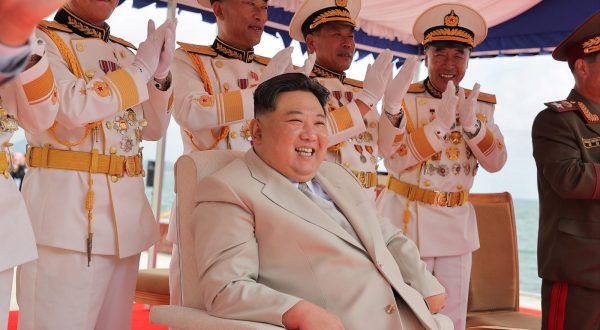 epa10847729 A photo released by the official North Korean Central News Agency (KCNA) shows North Korean leader Kim Jong Un (C) presiding over a launching ceremony for what is said to be a tactical nuclear-armed submarine, designated No. 841 or Hero Kim Kun Ok, at the Sinpho shipyard in North Korea, 06 September 2023 (issued 08 September 2023).  EPA/KCNA   EDITORIAL USE ONLY