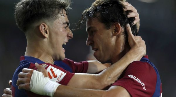 epa10865299 Barcelona's striker Joao Felix (R) jubilates with his teammate Gavi (L) after scoring the 1-0 goal during the LaLiga soccer match between FC Barcelona and Real Betis, in Barcelona, Catalonia, Spain, 16 September 2023.  EPA/ANDREU DALMAU