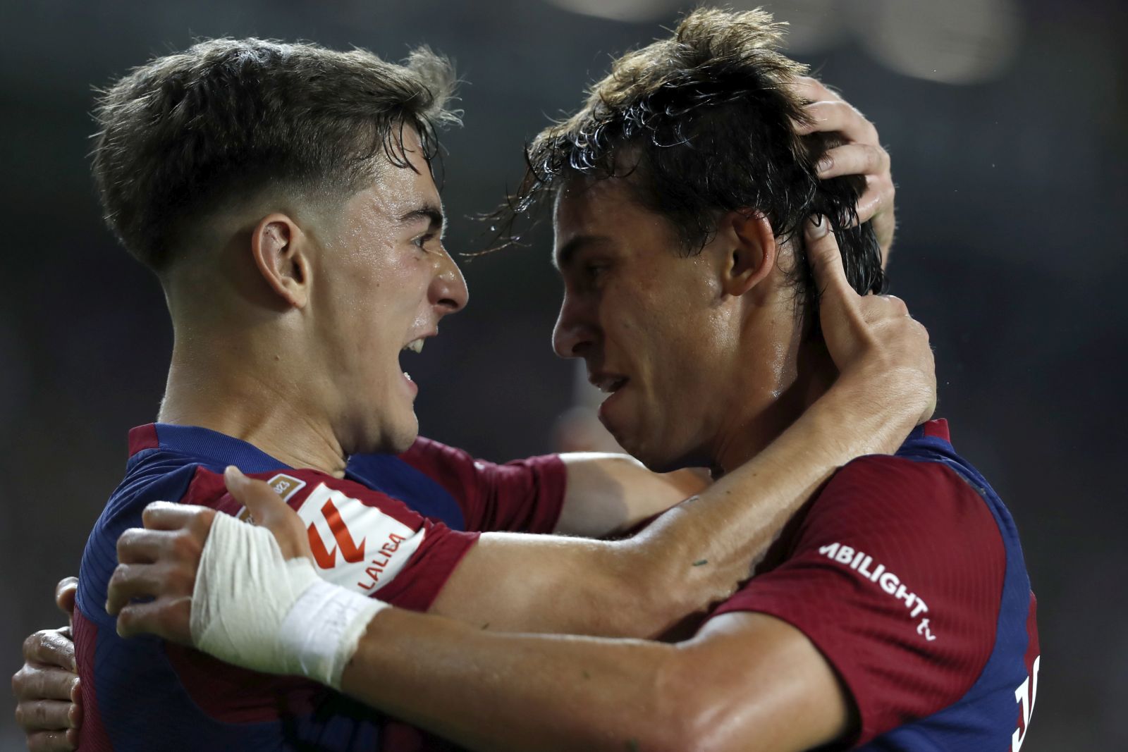 epa10865299 Barcelona's striker Joao Felix (R) jubilates with his teammate Gavi (L) after scoring the 1-0 goal during the LaLiga soccer match between FC Barcelona and Real Betis, in Barcelona, Catalonia, Spain, 16 September 2023.  EPA/ANDREU DALMAU
