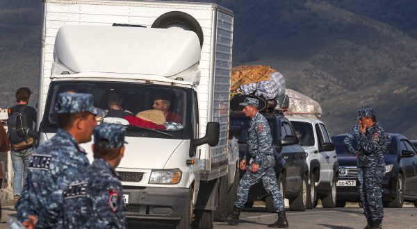 epa10887801 Armenian police organise passing of ethnic Armenians fleeing Nagorno-Karabakh region after they crossed the Azerbaijan-Armenia border near the village of Kornidzor, Armenia, 28 September 2023. Azerbaijan on 19 September 2023 launched a brief military offensive on the contested region of Nagorno-Karabakh, a breakaway enclave that is home to some 120,000 ethnic Armenians. The Armenian government announced the evacuation of more than 68,000 local residents from Nagorno-Karabakh, following a ceasefire agreed on 20 September with Azerbaijan. Nagorno-Karabakh will cease to exist as a self-proclaimed state from 01 January 2024, the regionâ€™s separatist leader, Samvel Shakhramanyan, announced on 28 September, after signing a decree to dissolve all its institutions.  EPA/ANATOLY MALTSEV