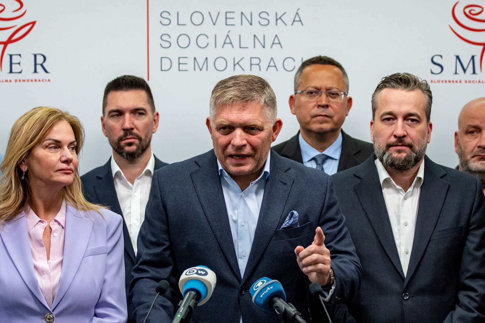 epa10893653 Slovak former Prime Minister and chairman of the Smer-SD party Robert Fico (C) talks to media after Slovakia's parliamentary elections at party's headquarters in Bratislava, Slovakia, 01 October 2023. According to official results, Smer-SD party with leader Robert Fico won the parliamentary elections with almost 23 percent. Progresivne Slovensko party (Progressive Slovakia) ended up behind him, with almost 18 percent.  EPA/MARTIN DIVISEK