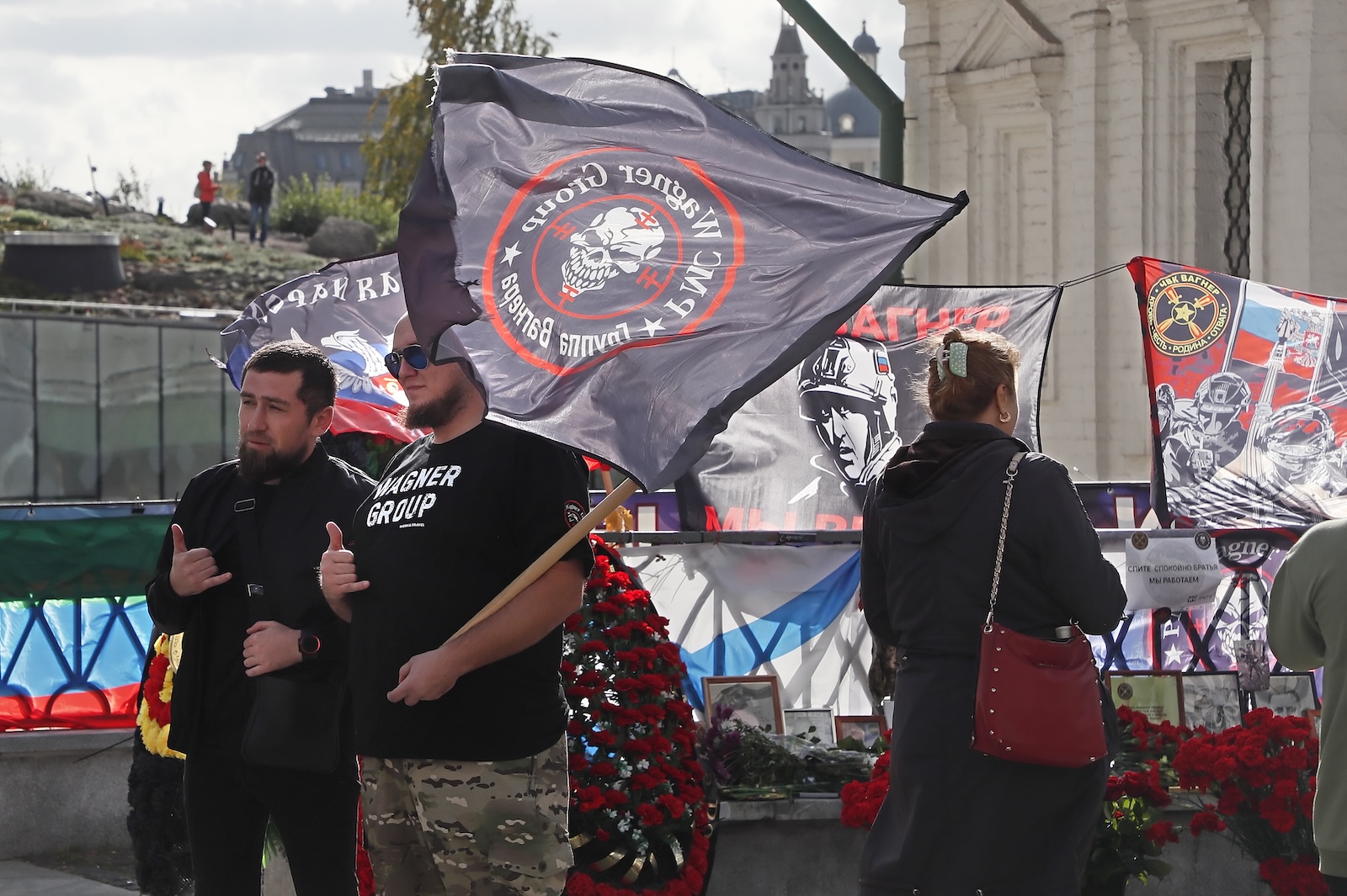 epa10894054 People pay tribute to PMC Wagner Group's late chief Yevgeny Prigozhin at an informal memorial on the 40th day since his death, near the Kremlin in Moscow, Russia, 01 October 2023. Russian authorities on 27 August 2023 confirmed that Prigozhin died along with nine others in the crash of an aircraft in the Tver region of Russia on 23 August 2023. He was buried on 29 August near his father's grave at the Porokhov cemetery on the outskirts of St. Petersburg.  EPA/MAXIM SHIPENKOV