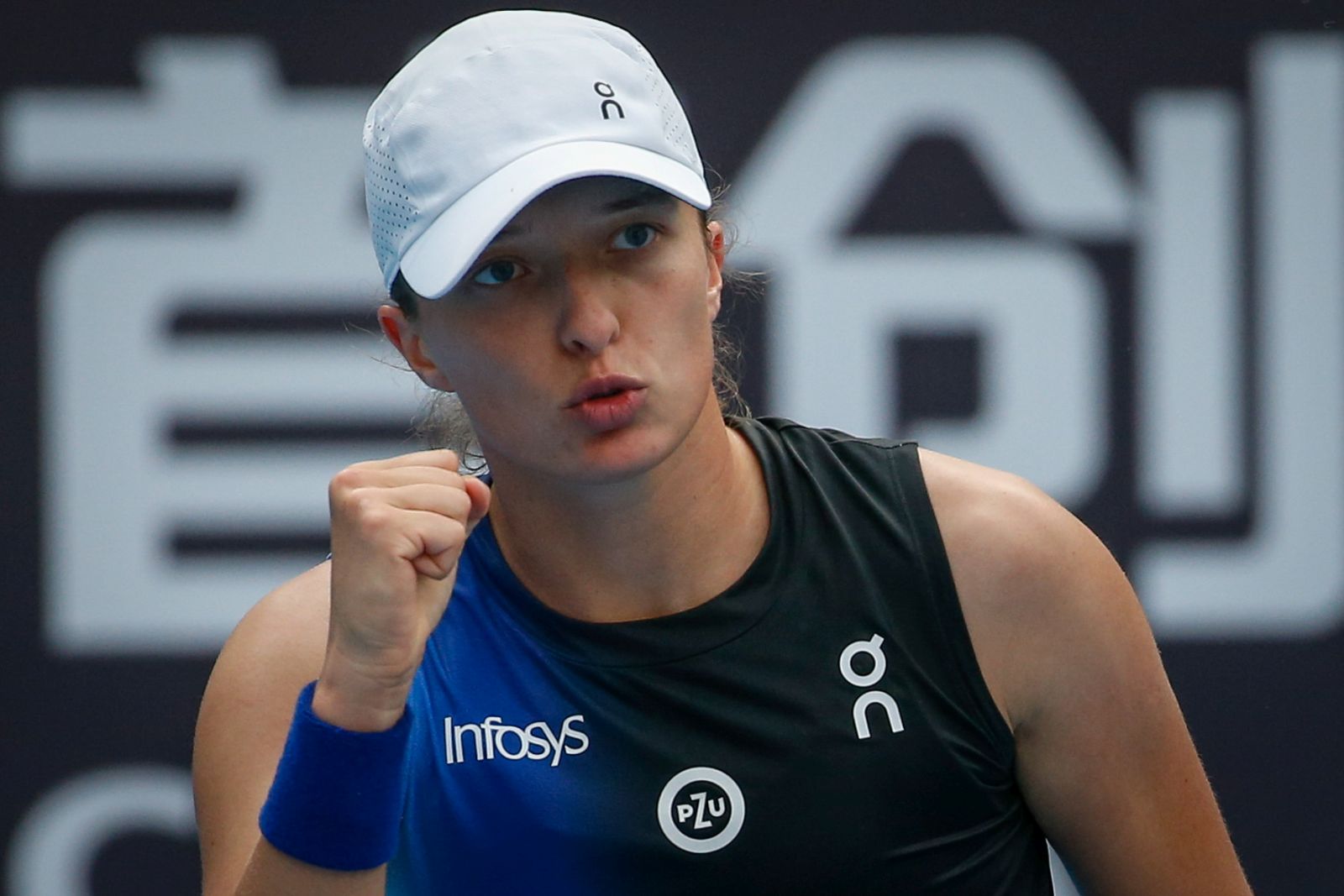 epa10895003 Iga Swiatek of Poland reacts during her match against Sara Sorribes Tormo of Spain in the China Open tennis tournament in Beijing, China, 02 October 2023.  EPA/MARK R. CRISTINO