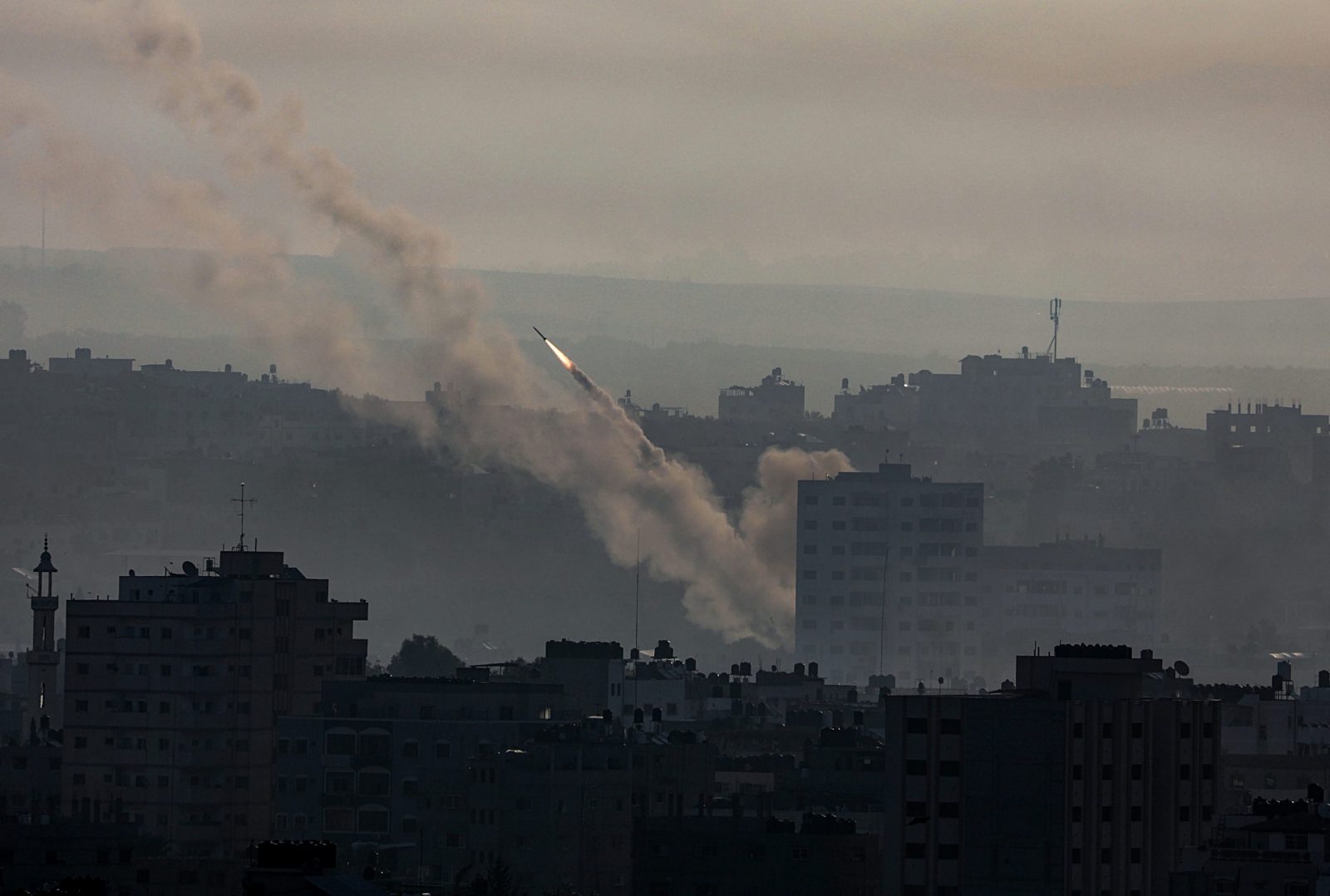 epa10904651 Rockets are launched from the coastal Gaza strip towards Israel by militants of the Ezz Al-Din Al Qassam militia, the military wing of Hamas movement, in Gaza City, 07 October 2023. Rocket barrages were launched from the Gaza Strip early Saturday in a surprise attack claimed by the Islamist movement Hamas.  EPA/MOHAMMED SABER