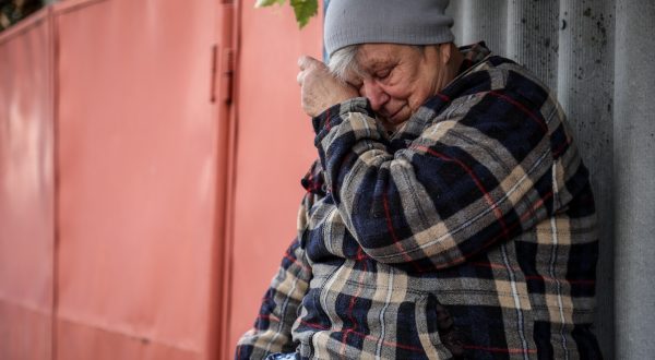 epa10905688 A local resident Alla cries near her home two days after a military strike hit the village of Hroza, Kupiansk district, Kharkiv region, northeastern Ukraine, 07 October 2023.. At least 52 people were killed, including a six-year-old child, and seven others were injured when a Russian missile hit the village on 05 October, as locals gathered to mourn a fallen Ukrainian soldier, the head of the Kharkiv military administration, Oleg Synegubov, said.  EPA/YAKIV LIASHENKO