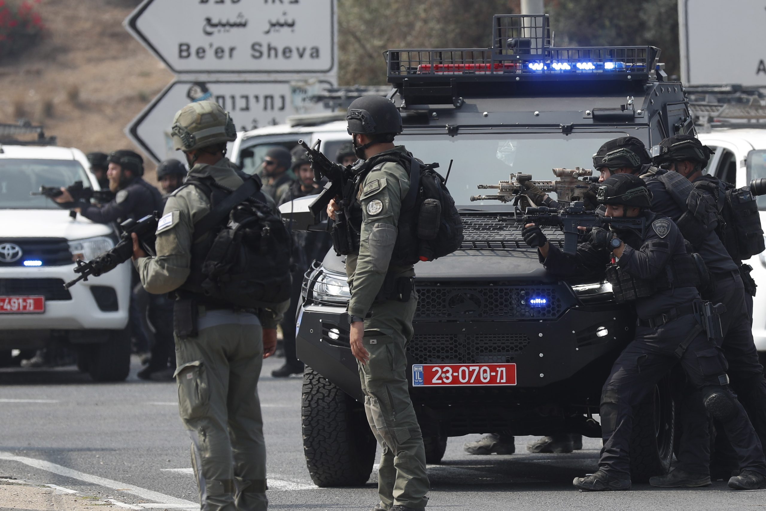 epa10907774 Israeli soldiers take position on the main road near the border with Gaza, 08 October 2023. Israel announced initiating a large-scale operation 'Swords of Iron' after surprise attacks on Israel on 07 October claimed by the Islamist movement Hamas killed more than 670 Israelis and left over 2,100 injured in the attacks, the Israeli army said 08 October.  EPA/ATEF SAFADI