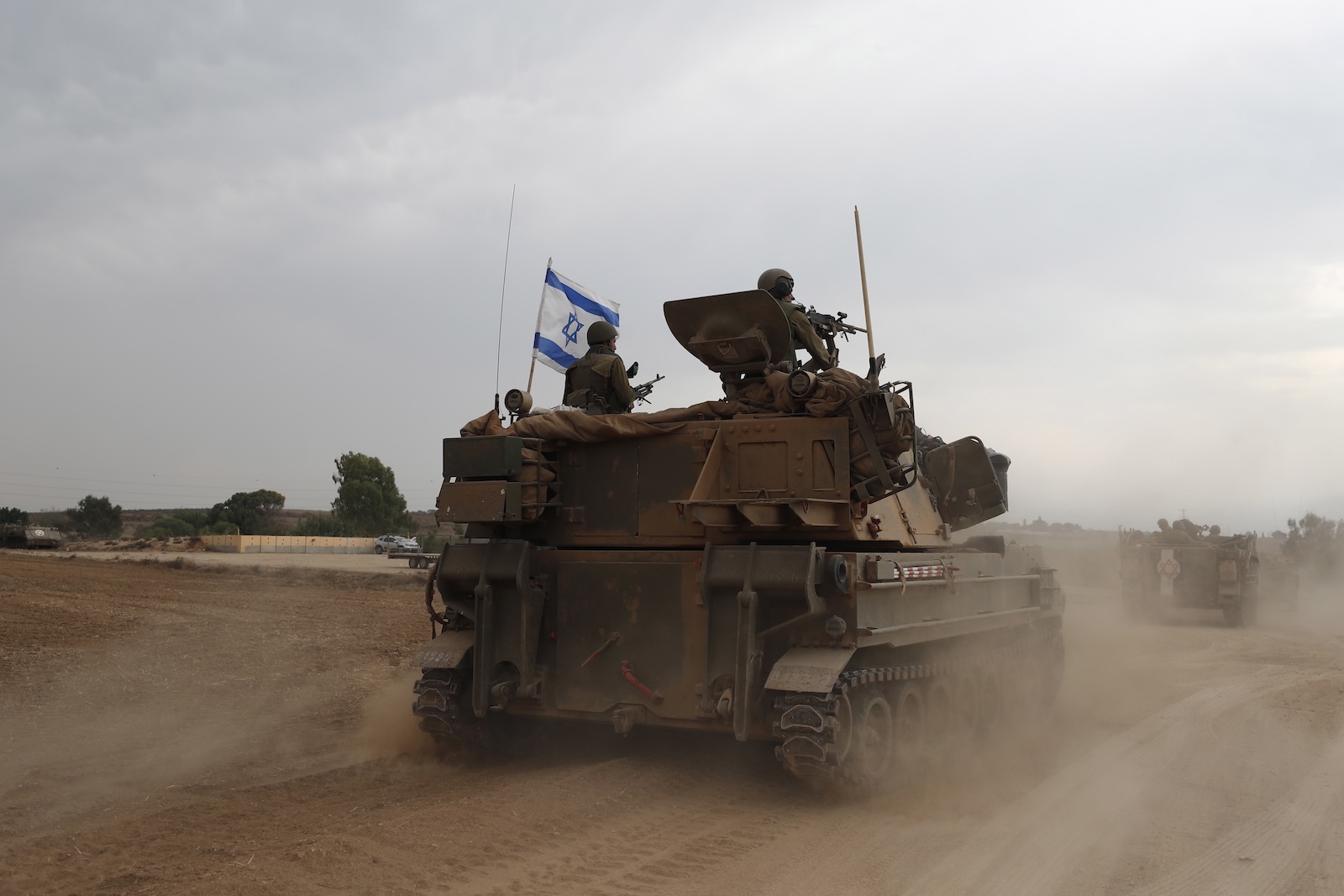 epa10909875 Israeli soldiers on military vehicles maneuver at an area along the border with Gaza, southern Israel, 09 October 2023. Israeli chief military spokesperson Rear-Admiral Daniel Hagari said on 09 October that the country had drafted a record of 300,000 reservists. More than 700 Israelis were killed and over 2,000 were injured since the Islamist movement Hamas carried out an unprecedented attack on southern Israel on 07 October, the Israeli army said. According to Palestinian officials, more than 500 people were killed and nearly 3,000 were injured as a result of Israelâ€™s retaliatory raids and air strikes in the Palestinian enclave.  EPA/ATEF SAFADI