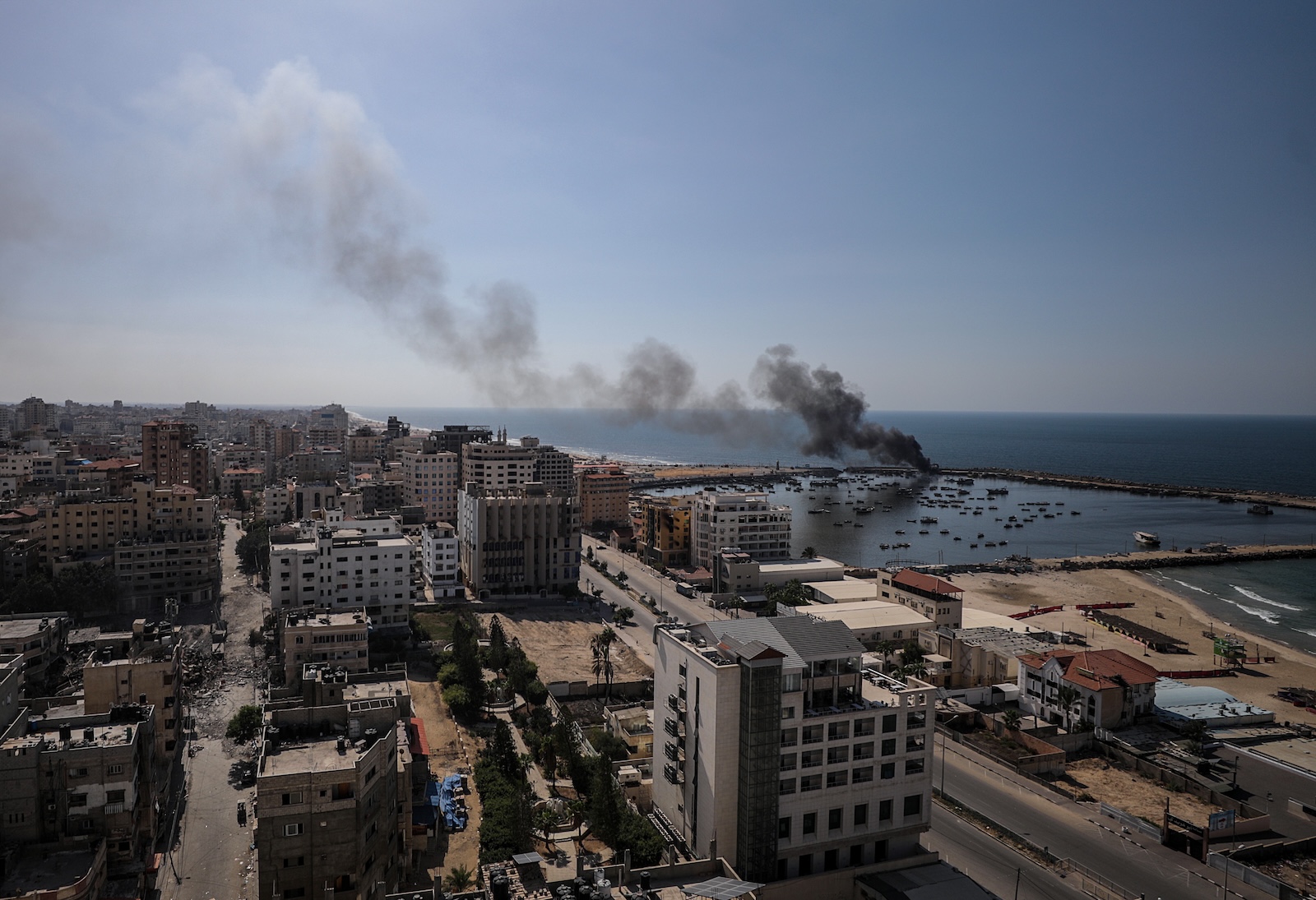 epaselect epa10914851 Smoke rises from the Gaza port following an Israeli air strike, in Gaza City, 12 October 2023. More than 1,400 Palestinians have been killed and over 6,000 others injured, according to the Palestinian Ministry of Health, after Israel started bombing the Palestinian enclave in response to attacks carried out by the Islamist movement Hamas on Israel from the Gaza Strip on 07 October. More than 4,000 people, including 1,500 militants from Hamas, have been killed and thousands injured in Gaza and Israel since 07 October, according to Israeli military sources and Palestinian officials.  EPA/MOHAMMED SABER