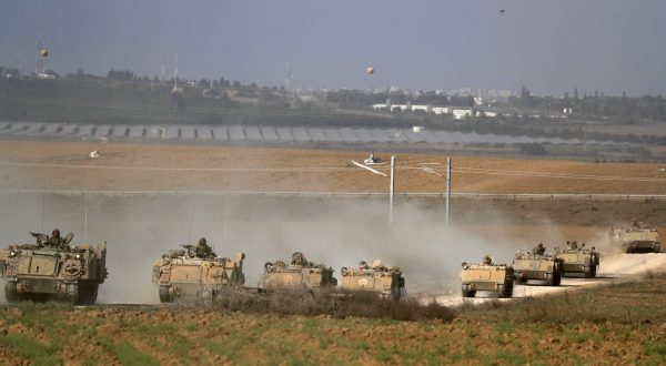 epa10916242 A column of heavy armoured personnel carriers (APCs) at an area along the border with Gaza, southern Israel, 13 October 2023. The Israel Defense Forces (IDF) on 13 October called for the evacuation of all civilians of Gaza City from their homes southwards 'for their own safety and protection' and to move south of the Wadi Gaza, warning that in the following days Israeli military operations will take place in the Palestinian city. More than 1,300 Israelis have been killed and over 3,200 others injured, according to the IDF, after the Islamist movement Hamas launched an attack against Israel from the Gaza Strip on 07 October. More than 1,500 Palestinians have been killed and over 6,600 others injured in Gaza since Israel launched retaliatory air strikes, Palestinian health officials said.  EPA/ATEF SAFADI