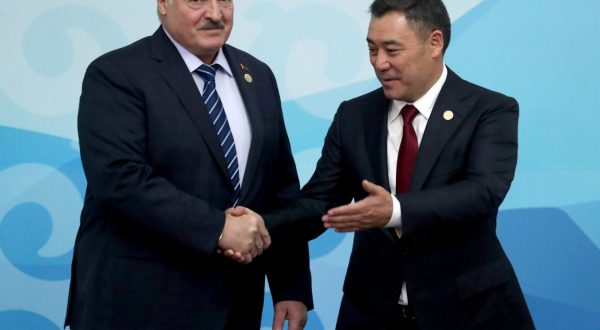epa10916324 Belarus' President Alexander Lukashenko (L) and Kyrgyz President Sadyr Japarov (R) shake hands before a meeting of the heads of state of the Commonwealth of Independent States (CIS) at the Ala-Archa state residence in Bishkek, Kyrgyzstan, 13 October 2023.  EPA/IGOR KOVALENKO