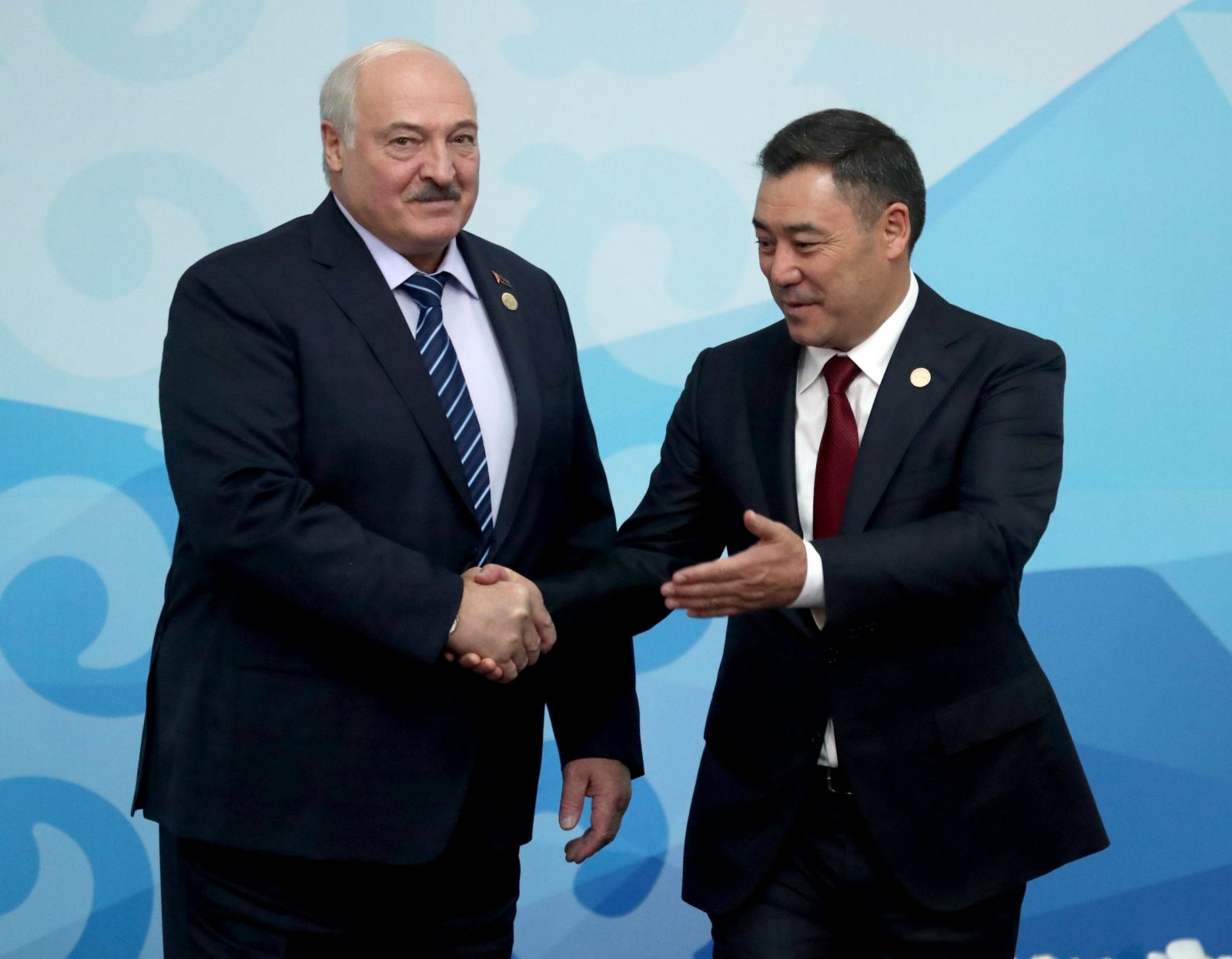 epa10916324 Belarus' President Alexander Lukashenko (L) and Kyrgyz President Sadyr Japarov (R) shake hands before a meeting of the heads of state of the Commonwealth of Independent States (CIS) at the Ala-Archa state residence in Bishkek, Kyrgyzstan, 13 October 2023.  EPA/IGOR KOVALENKO