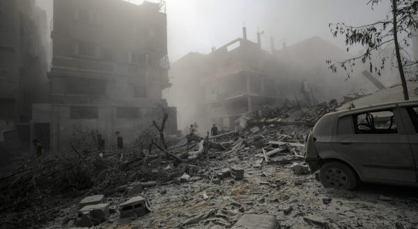 epa10934081 Palestinians walk through a destroyed area after Israeli air strikes in Gaza City, 23 October 2023. More than 4,700 Palestinians and over 1,400 Israelis have been killed, according to the Israel Defense Forces (IDF) and the Palestinian health authority, since Hamas militants launched an attack against Israel from the Gaza Strip on 07 October.  EPA/MOHAMMED SABER