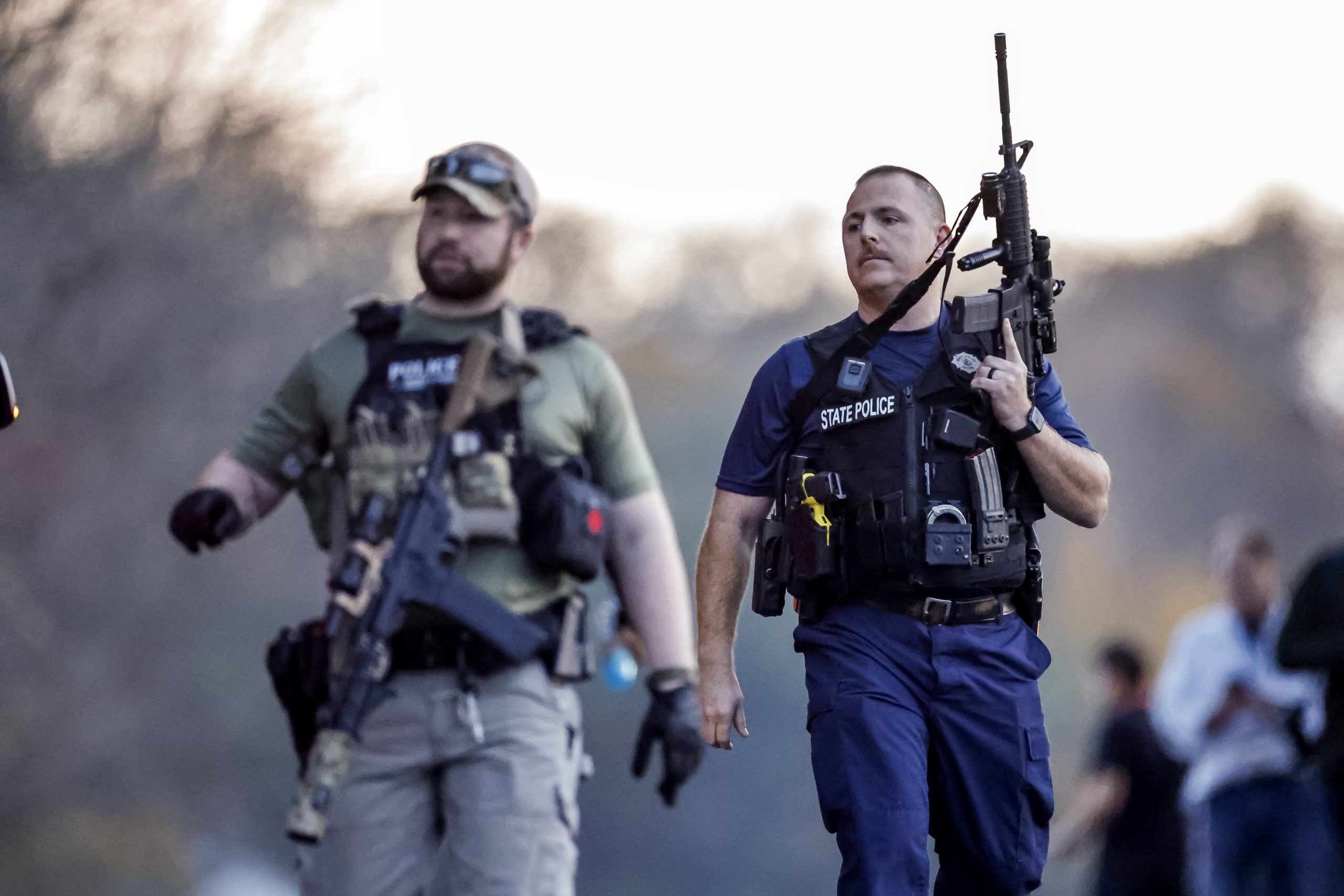 epa10941775 Law enforcement gather near the home of mass-shooting suspect Robert Card in Bowdoin, Maine, USA, 26 October 2023. Police are searching for suspect Robert Card following a mass shooting which killed 18 and injured 13 in nearby Lewiston, Maine, on 25 October 2023.  EPA/CJ GUNTHER