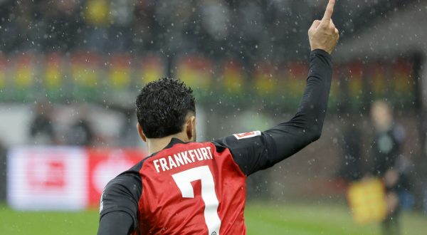 epa10947528 Frankfurt's Omar Marmoush  celebrates after scoring the 1-0 lead by penalty during the German Bundesliga soccer match between Eintracht Frankfurt and Borussia Dortmund in Frankfurt, Germany, 29 October 2023.  EPA/RONALD WITTEK CONDITIONS - ATTENTION: The DFL regulations prohibit any use of photographs as image sequences and/or quasi-video.