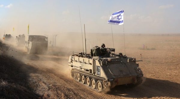 epa10920321 Israeli armoured personnel carriers (APCs) maneuver at an area along the border with Gaza, southern Israel, 15 October 2023. The Israel Defense Force (IDF) on 14 October announced they are increasing readiness and preparing to 'implement a wide range of operational offensive plans', including combined and coordinated strikes by land, sea and air. Israel has called for the evacuation of all civilians of northern Gaza ahead of an expected ground invasion. More than 1,300 Israelis have been killed and over 3,200 others injured, according to the IDF, after the Islamist movement Hamas launched an attack against Israel from the Gaza Strip on 07 October. More than 2,300 Palestinians have been killed and over 9,000 others injured in Gaza since Israel launched retaliatory air strikes, the Palestinian health ministry said.  EPA-EFE/ABIR SULTAN