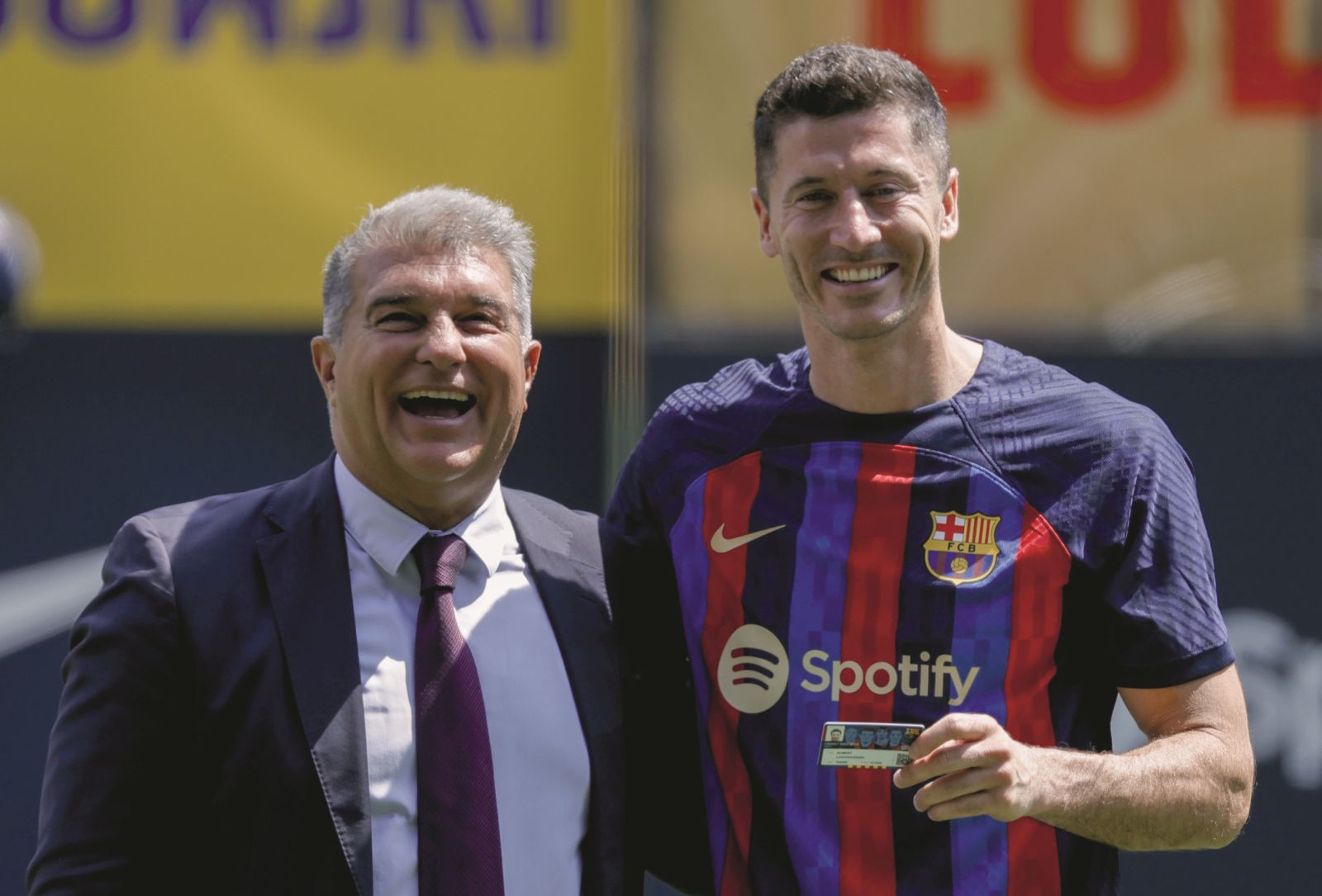 Polish forward Robert Lewandowski, right, and FC Barcelona president Joan Laporta react, during the official presentation after signing for FC Barcelona, in Barcelona, Spain, Friday, Aug. 5, 2022. (AP Photo/Joan Monfort)