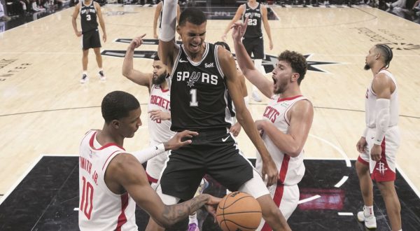 San Antonio Spurs center Victor Wembanyama (1) reacts to a play during overtime of the team's NBA basketball game against the Houston Rockets in San Antonio, Friday, Oct. 27, 2023. (AP Photo/Eric Gay)