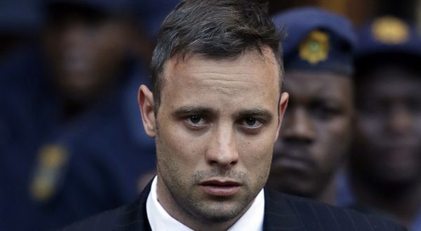 FILE - Oscar Pistorius leaves the High Court in Pretoria, South Africa, Wednesday, June 15, 2016, after his sentencing proceedings. Pistorius could be granted parole on Friday, Nov. 24, 2023 after nearly 10 years in prison for killing his girlfriend. The double-amputee Olympic runner was convicted of a charge comparable to third-degree murder for shooting Reeva Steenkamp in his home in 2013. He has been in prison since late 2014. (AP Photo/Themba Hadebe, File)