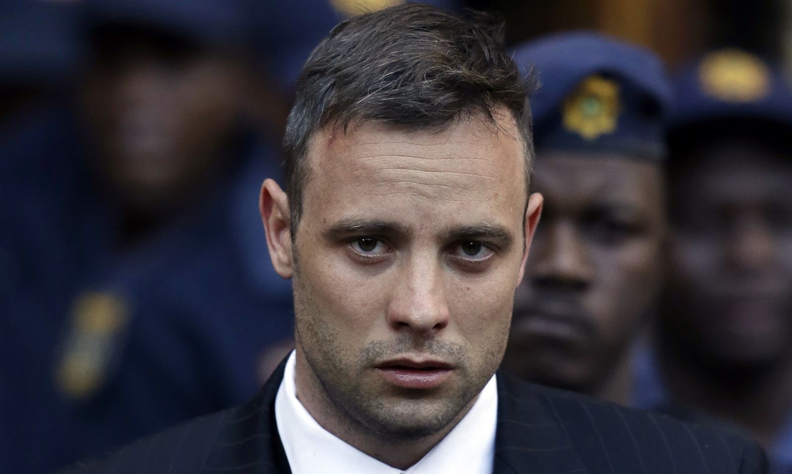 FILE - Oscar Pistorius leaves the High Court in Pretoria, South Africa, Wednesday, June 15, 2016, after his sentencing proceedings. Pistorius could be granted parole on Friday, Nov. 24, 2023 after nearly 10 years in prison for killing his girlfriend. The double-amputee Olympic runner was convicted of a charge comparable to third-degree murder for shooting Reeva Steenkamp in his home in 2013. He has been in prison since late 2014. (AP Photo/Themba Hadebe, File)