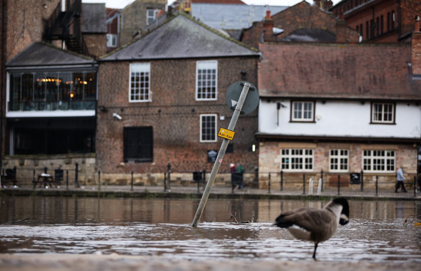 epa10949163 A submerged street sign stands in flood water in York, Britain, 30 October 2023. Severe flood warnings are in place in parts of North Yorkshire following weeks of heavy rain brought by storms Agnes and Babet. The Meteorological Office is forecasting strong winds and heavy rain across southern England as Storm Ciaran is expected to arrive on 01 November.  EPA/ADAM VAUGHAN