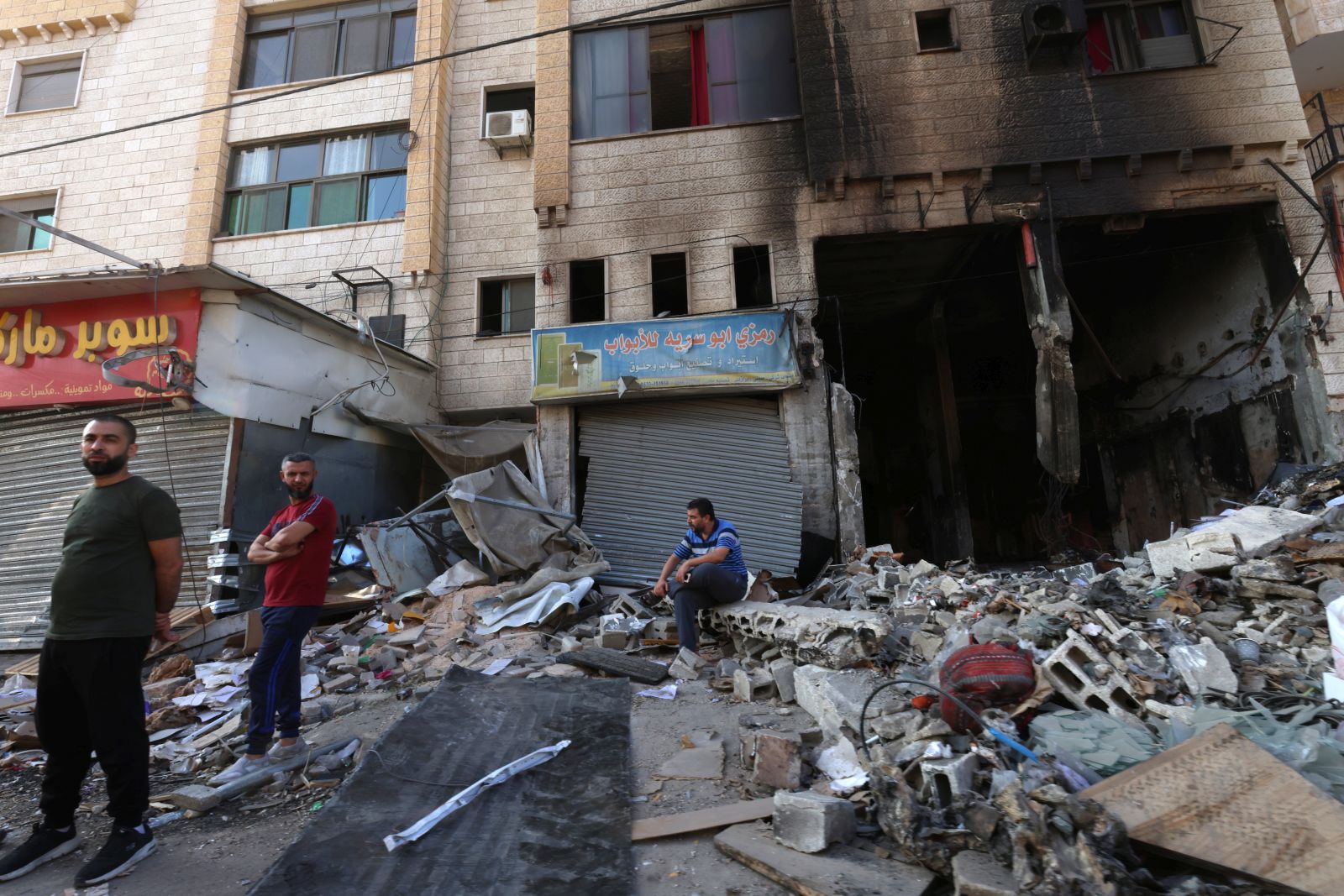epa10952087 Palestinians inspect the damage following heavy clashes during an Israeli raid at Jenin refugee camp, in the West Bank city of Jenin, 01 November 2023. According to the Palestinian Health Ministry, three Palestinians were killed in the Israeli raids in Jenin refugee camp. More than 120 Palestinians have been killed and over 2,000 have been injured in the West Bank between 07-30 October, following the escalation of hostilities between Israel and Hamas, the ministry said.  EPA/ALAA BADARNEH