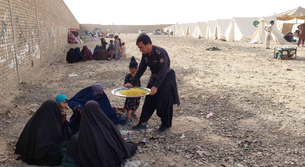 epa10953961 Afghan refugees receive food as they stay at holding camps for verification after the Pakistani government's deadline to expel undocumented immigrants passed, near the Afghan border in Chaman, Pakistan, 02 November 2023. Pakistan is expected to implement its plan to expel undocumented immigrants as the deadline for them to leave the country expired. The move particularly affects the millions of Afghan refugees who had fled their homeland, many of them driven by decades of armed conflict and the return to power of the Taliban. Since the Pakistani authorities announced the 31 October deadline, a huge migratory flow has been recorded on the porous border between Pakistan and Afghanistan. According to official data, about 4.4 million Afghans are living in the country, of which 1.7 million are not registered.  EPA/AKHTER GULFAM
