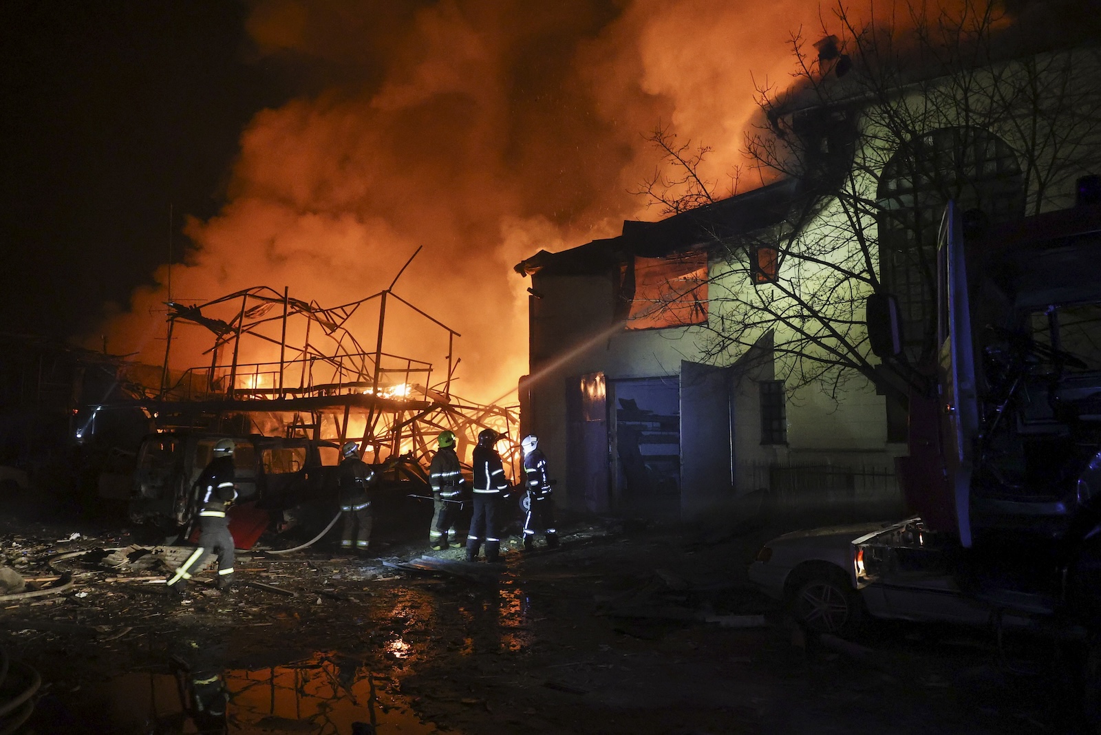 epa10955621 Emergency personnel work at the site of a drone strike in Kharkiv, northeastern Ukraine, early 03 November 2023, amid the Russian invasion. The Kharkiv region police said at least 10 Russian drones hit Kharkiv and its suburbs, and as a result of the strikes, a residential building, a service station, and an administrative building were on fire. There were no immediate reports on casualties, police added. Russian forces launched a 'massive attack' on Ukraine overnight, with strikes reported in the regions of Kharkiv, Kherson, Donetsk, Odesa and Ivano-Frankivsk, Ukrainian Interior Minister Ihor Klymenko wrote on telegram.  EPA/SERGEY KOZLOV