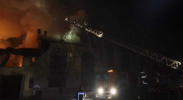 epa10955627 Emergency personnel work at the site of a drone strike in Kharkiv, northeastern Ukraine, early 03 November 2023, amid the Russian invasion. The Kharkiv region police said at least 10 Russian drones hit Kharkiv and its suburbs, and as a result of the strikes, a residential building, a service station, and an administrative building were on fire. There were no immediate reports on casualties, police added. Russian forces launched a 'massive attack' on Ukraine overnight, with strikes reported in the regions of Kharkiv, Kherson, Donetsk, Odesa and Ivano-Frankivsk, Ukrainian Interior Minister Ihor Klymenko wrote on telegram.  EPA/SERGEY KOZLOV