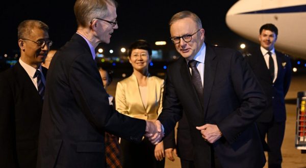 epa10957108 Australia's Ambassador to China Graham Fletcher greets Australia’s Prime Minister Anthony Albanese (R) after arriving at Hongqiao Airport in Shanghai, China, 04 November 2023. Anthony Albanese will hold talks in China with President Xi Jinping in the first visit to the Asian nation by a sitting prime minister since 2016.  EPA/LUKAS COCH AUSTRALIA AND NEW ZEALAND OUT